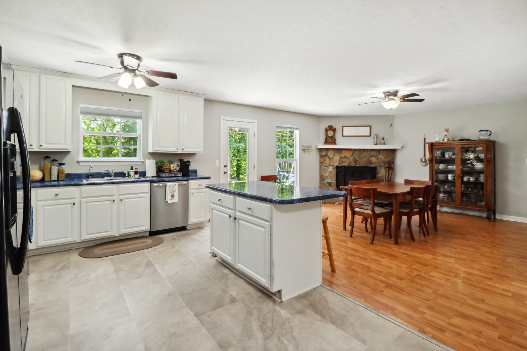 4956 Minnis Road Springfield, TN 37172 - Photo 22 of 32 a kitchen with stainless steel appliances granite countertop a table chairs sink and cabinets