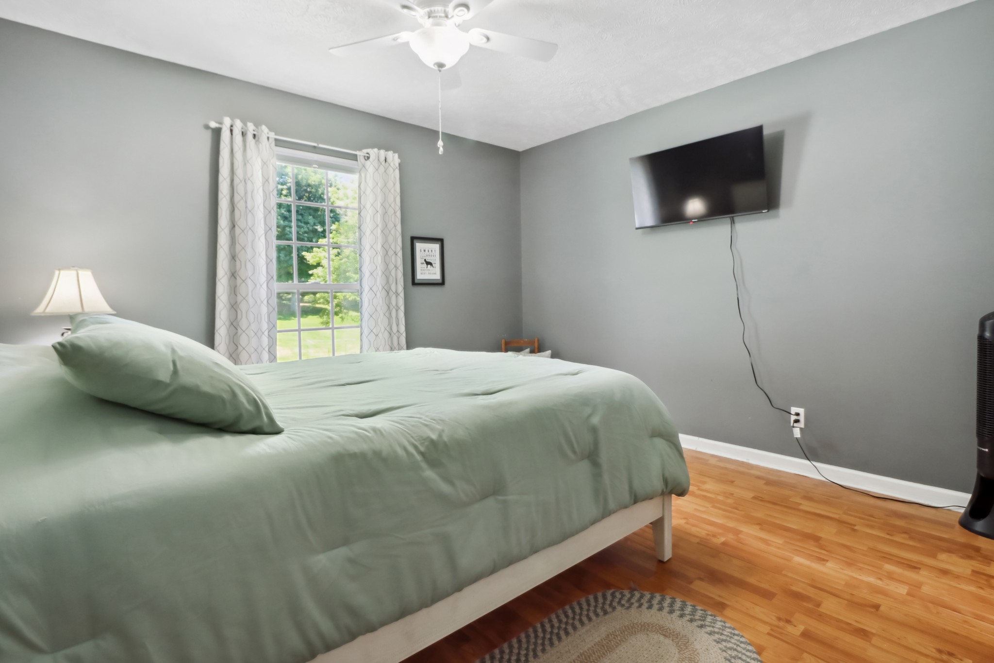 4956 Minnis Road Springfield, TN 37172 - Photo 27 of 32 a bedroom with a bed and a flat screen tv