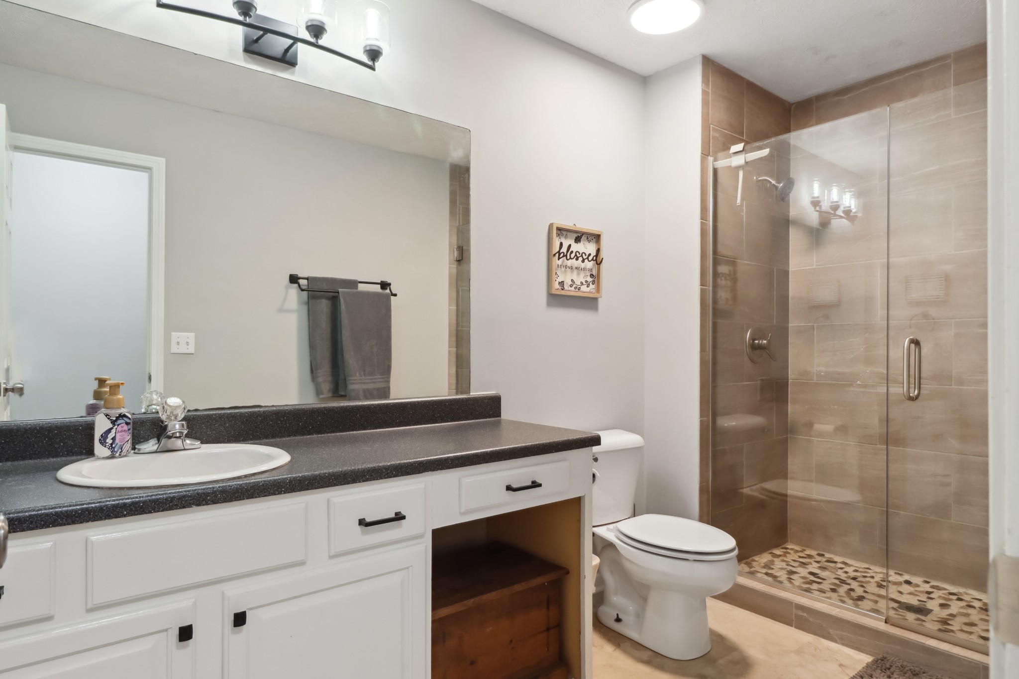 4956 Minnis Road Springfield, TN 37172 - Photo 29 of 32 a bathroom with a sink a toilet and shower
