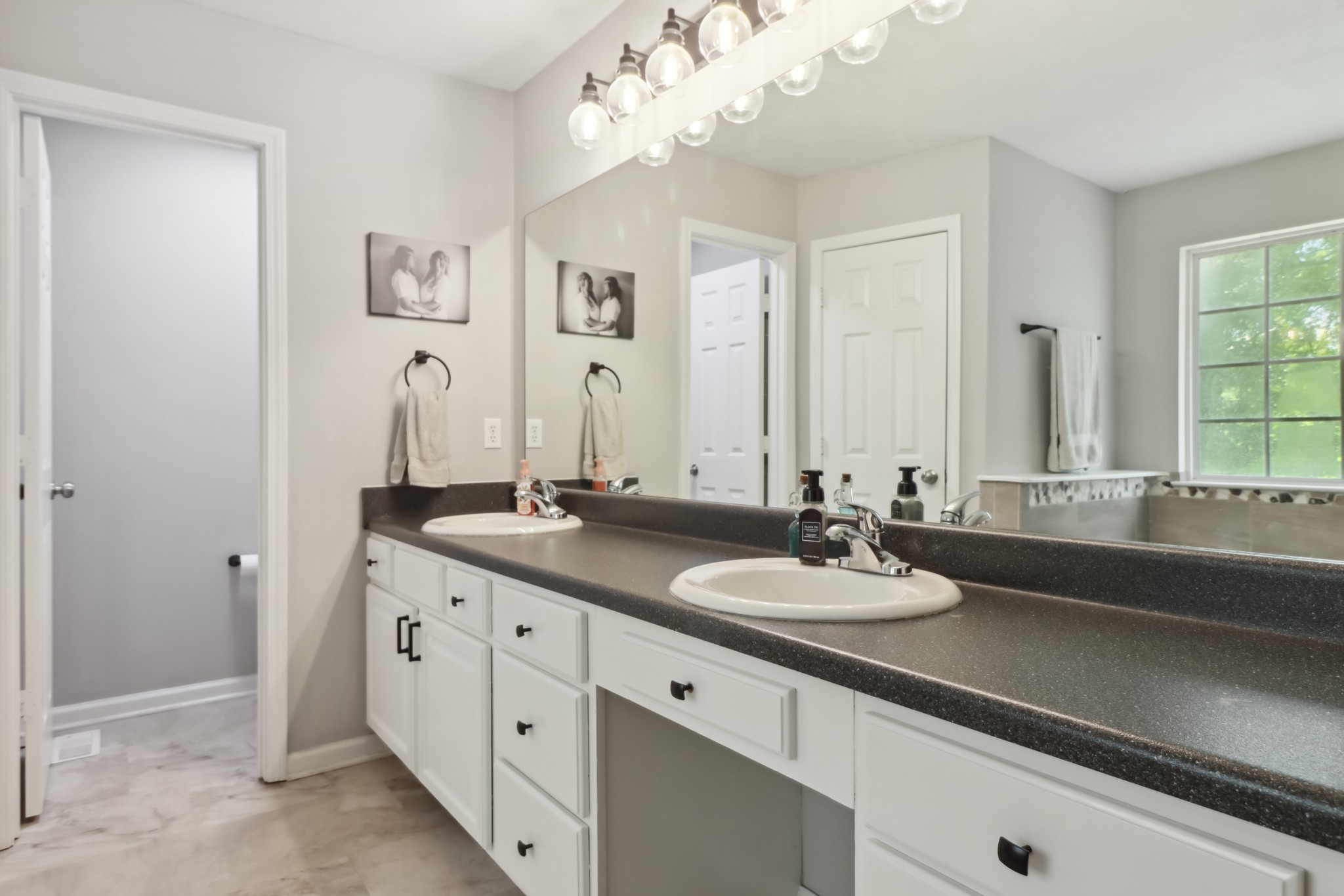 4956 Minnis Road Springfield, TN 37172 - Photo 30 of 32 a bathroom with a double vanity sink and a mirror