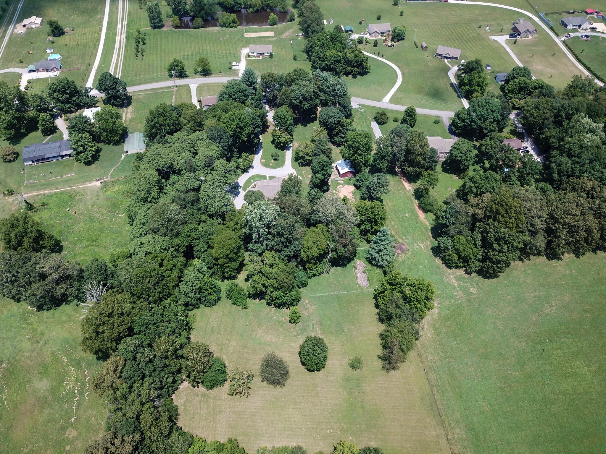 4956 Minnis Road Springfield, TN 37172 - Photo 9 of 32 an aerial view of a house with a yard and lake view
