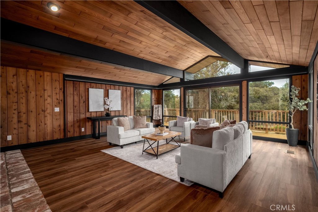 7744 West Lilac Road Bonsall, CA 92003 - Photo 12 of 60 a living room with furniture and large windows