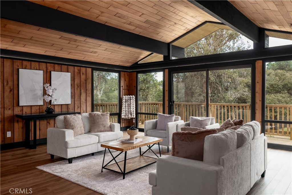 7744 West Lilac Road Bonsall, CA 92003 - Photo 13 of 60 a living room with furniture and a large window