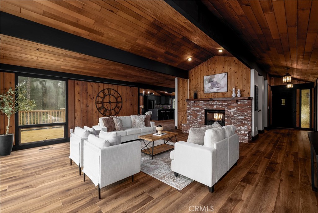 7744 West Lilac Road Bonsall, CA 92003 - Photo 14 of 60 a living room with furniture and a fireplace