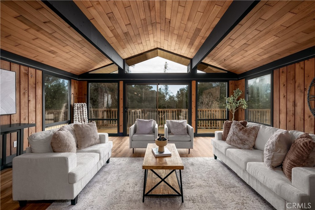 7744 West Lilac Road Bonsall, CA 92003 - Photo 2 of 60 a living room with furniture and a large window
