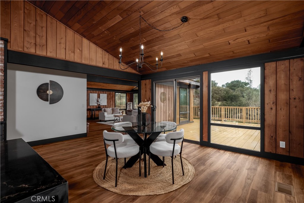 7744 West Lilac Road Bonsall, CA 92003 - Photo 22 of 60 a workspace with furniture window and wooden floor