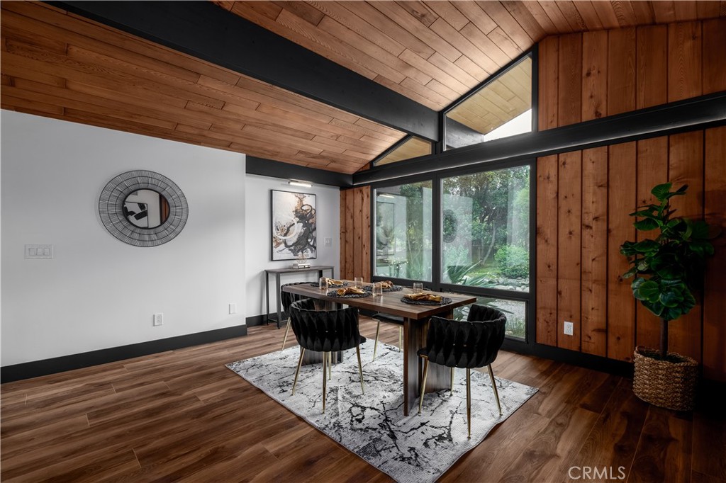 7744 West Lilac Road Bonsall, CA 92003 - Photo 24 of 60 a view of a dining room with furniture window and wooden floor