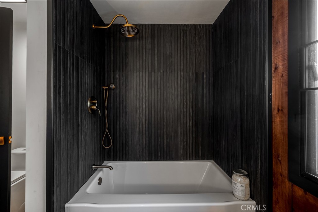 7744 West Lilac Road Bonsall, CA 92003 - Photo 29 of 60 a bathroom with a bathtub