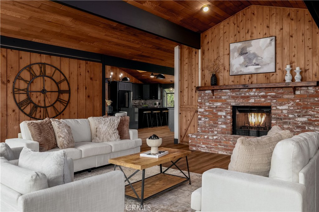 7744 West Lilac Road Bonsall, CA 92003 - Photo 3 of 60 a living room with furniture and a fireplace