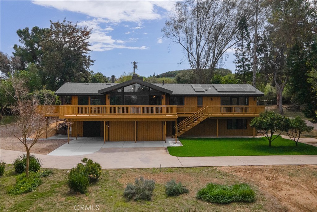 7744 West Lilac Road Bonsall, CA 92003 - Photo 49 of 60 a front view of a house with a yard