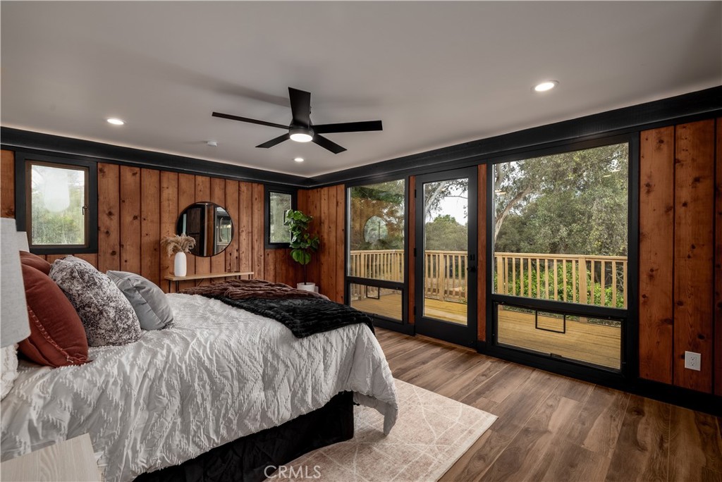 7744 West Lilac Road Bonsall, CA 92003 - Photo 5 of 60 a bedroom with a large bed and a large window