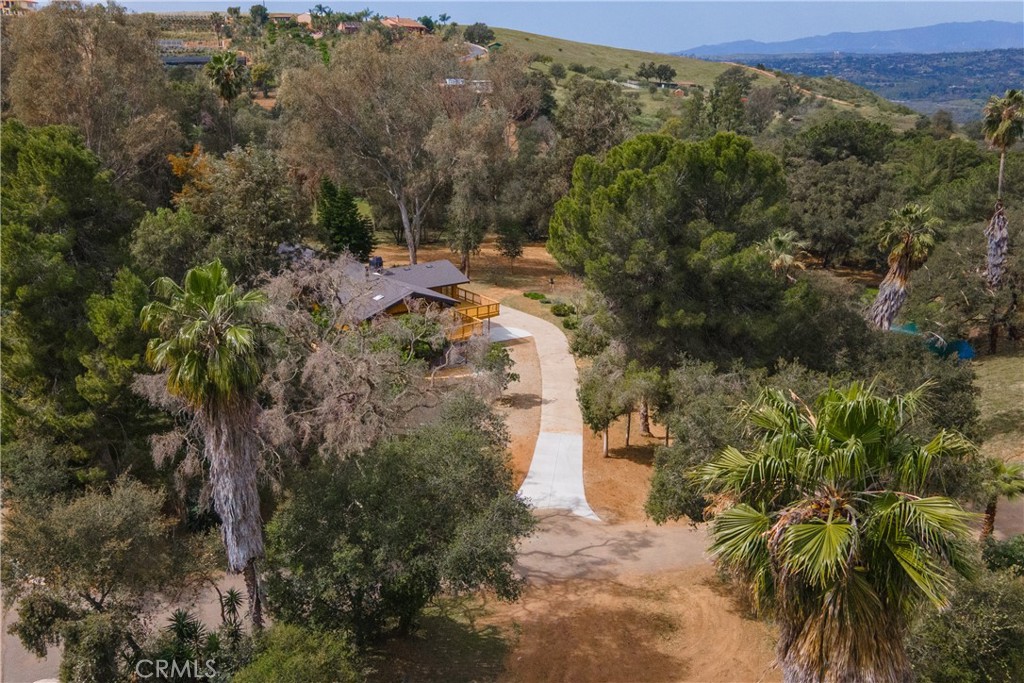 7744 West Lilac Road Bonsall, CA 92003 - Photo 52 of 60 a view of a city with lush green forest