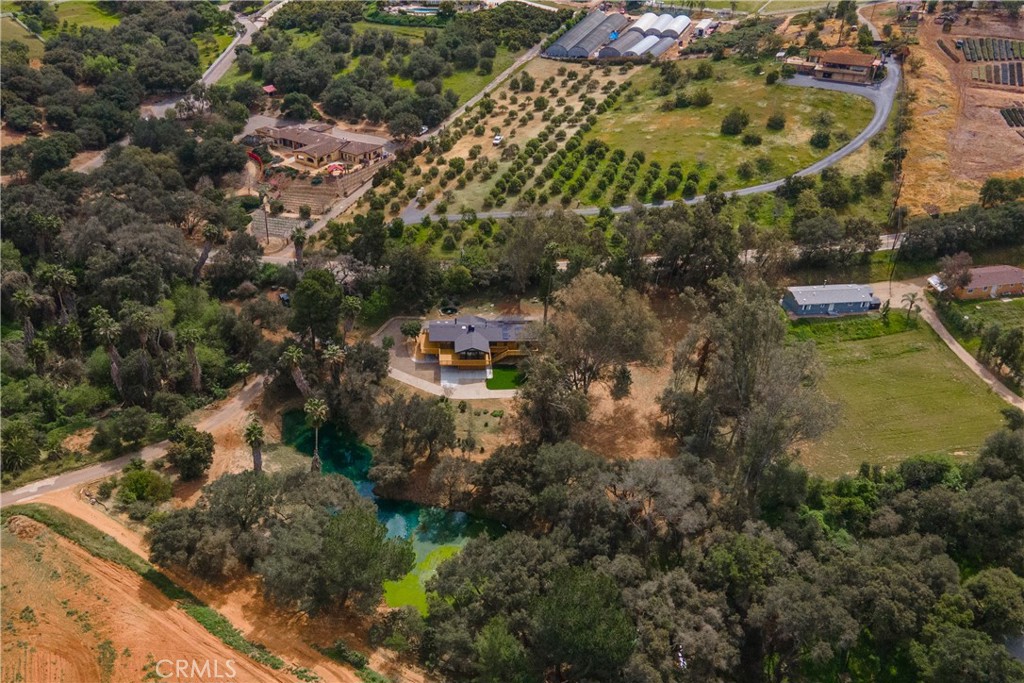 7744 West Lilac Road Bonsall, CA 92003 - Photo 55 of 60 an aerial view of residential houses with outdoor space