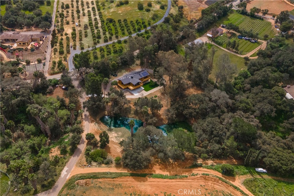 7744 West Lilac Road Bonsall, CA 92003 - Photo 56 of 60 an aerial view of residential house with outdoor space and swimming pool