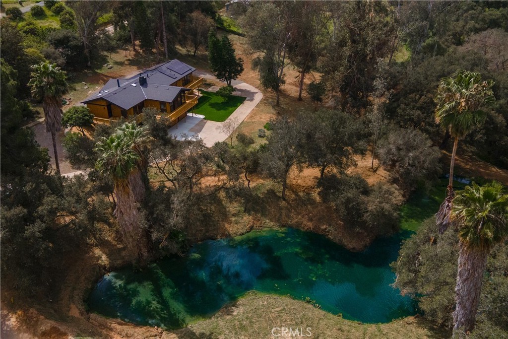 7744 West Lilac Road Bonsall, CA 92003 - Photo 57 of 60 a view of a house with a yard