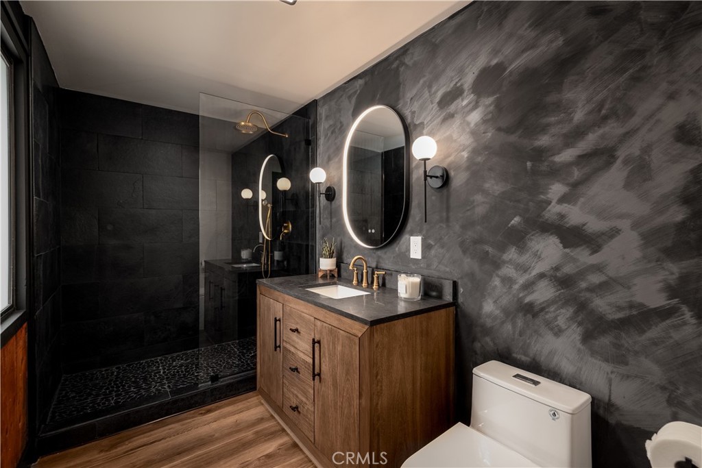 7744 West Lilac Road Bonsall, CA 92003 - Photo 6 of 60 a bathroom with a sink and a mirror