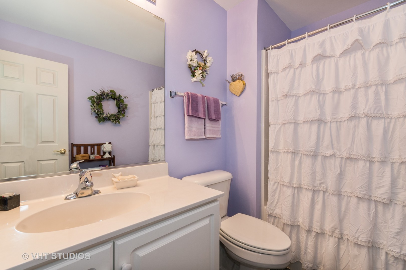 3132 Raphael Court St. Charles, IL 60175 - Photo 11 of 14 a bathroom with a sink vanity mirror and toilet