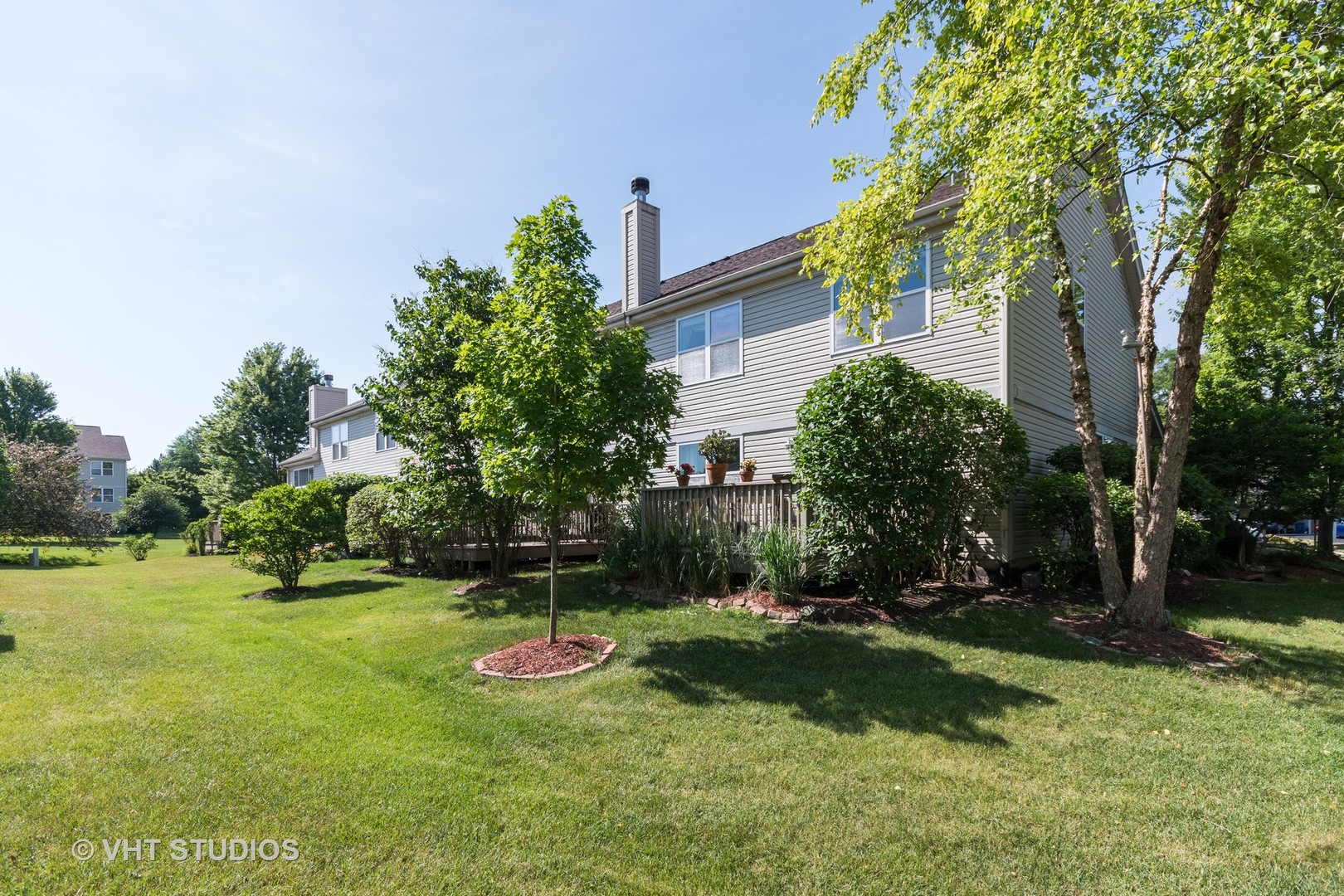 3132 Raphael Court St. Charles, IL 60175 - Photo 14 of 14 a view of a backyard with plants and trees