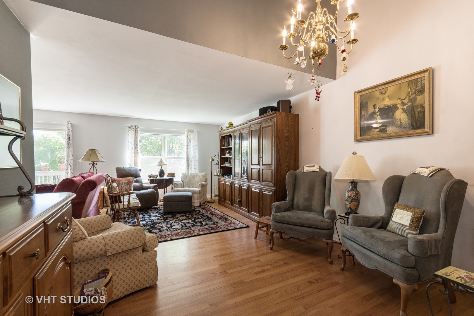 3132 Raphael Court St. Charles, IL 60175 - Photo 5 of 14 a living room with furniture chandelier and a flat screen tv