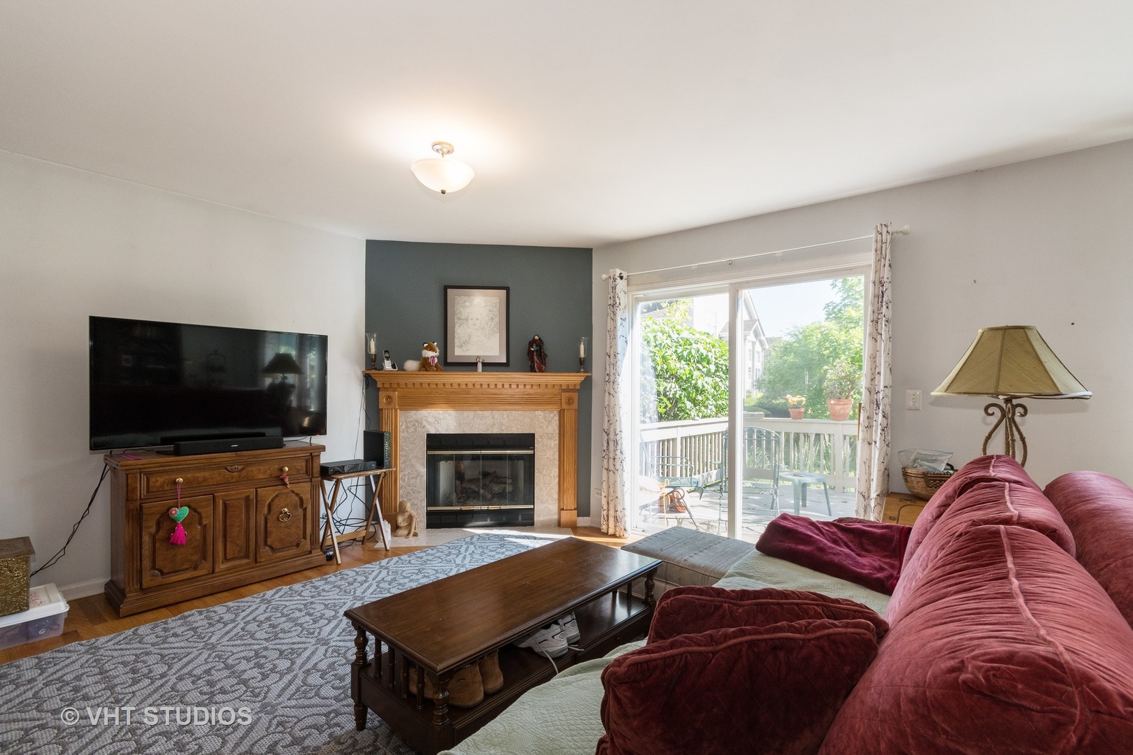 3132 Raphael Court St. Charles, IL 60175 - Photo 6 of 14 a living room with furniture and a flat screen tv