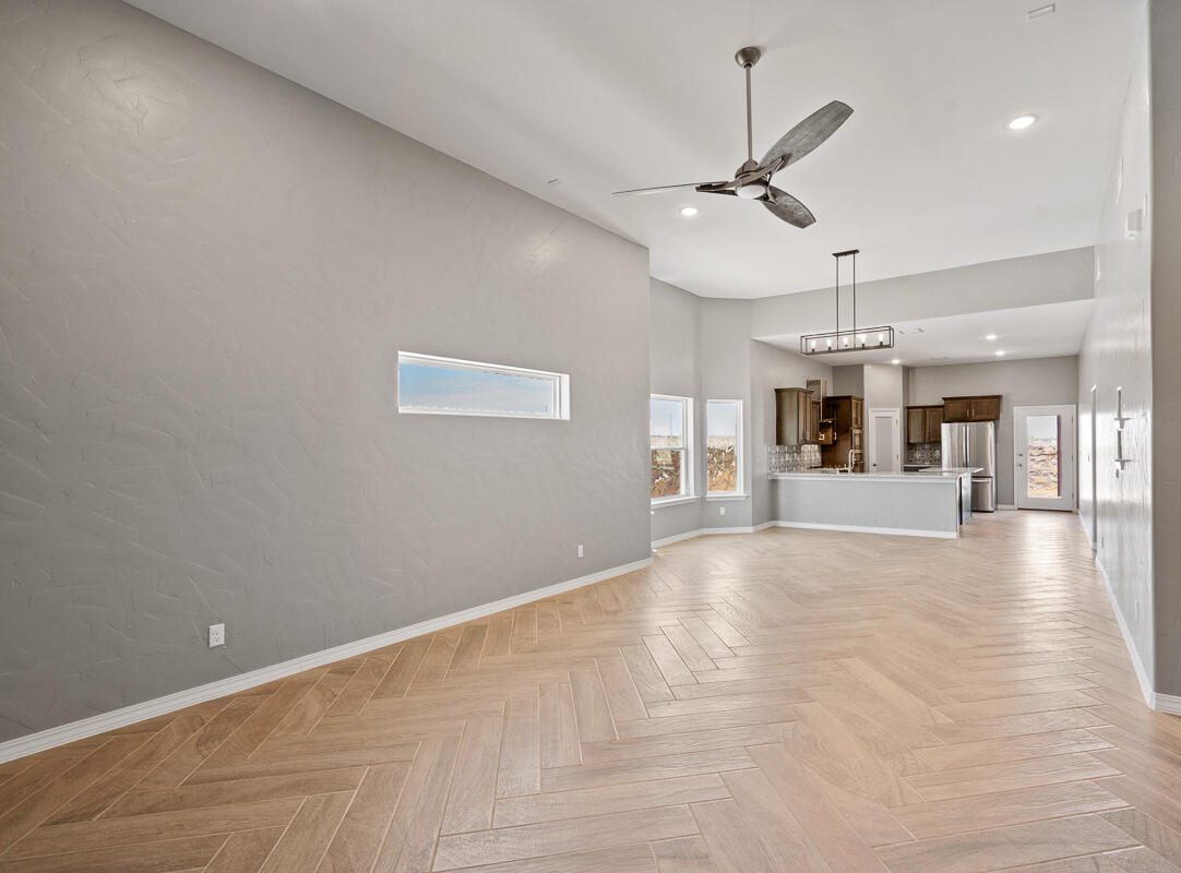 6026 Spring Ridge Sunland Park, NM 88008 - Photo 4 of 17 a view of an empty room with window and wooden floor