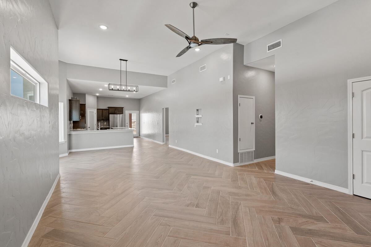 6026 Spring Ridge Sunland Park, NM 88008 - Photo 6 of 17 a view of a kitchen with a sink and a refrigerator