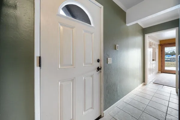 a view of a balcony with wooden floor and fence