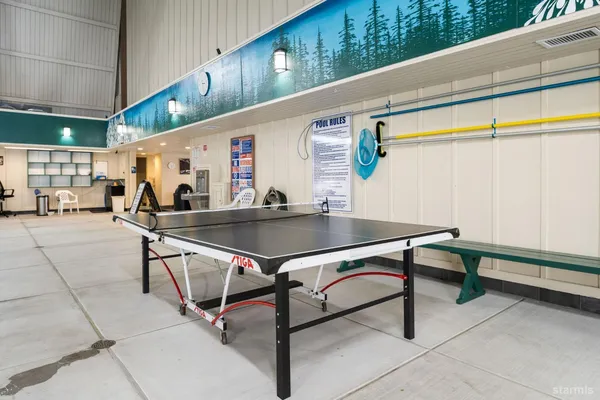 a swimming pool with outdoor seating and lake view