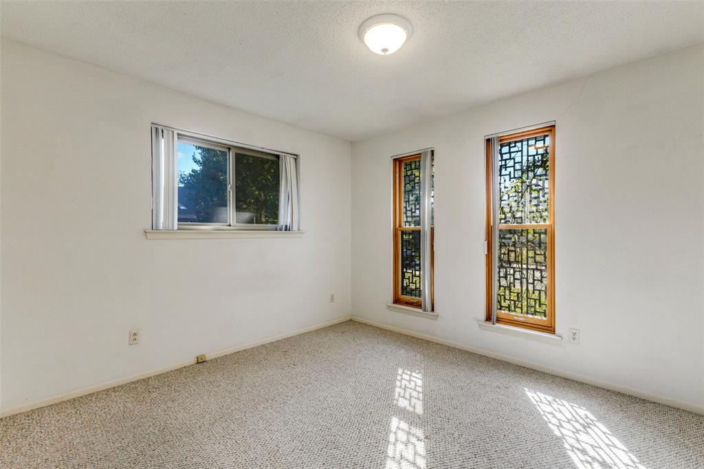 2271 Homeway Circle Dallas, TX 75228 - Photo 13 of 17 an empty room with windows