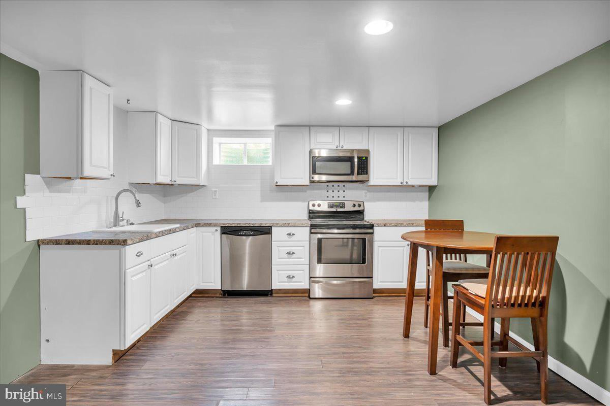 64 Blue Anchor Road Sicklerville, NJ 08081 - Photo 21 of 47 a kitchen with granite countertop white cabinets and appliances