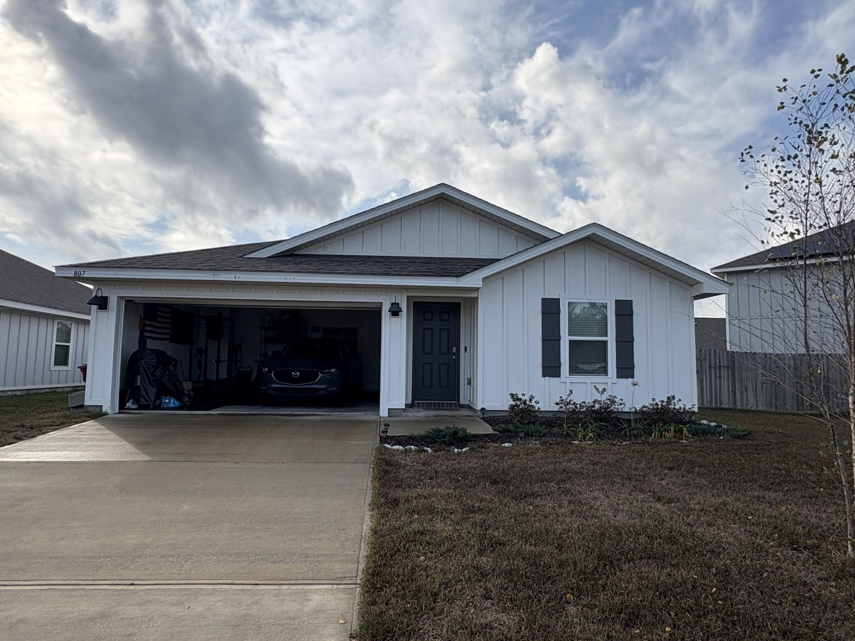 807 Otto Loop Crestview, FL 32539 - Photo 1 of 1 a view of a house with backyard and garden