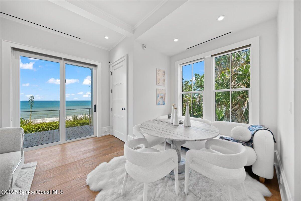 5525 Jimmy Buffett Mem Highway Melbourne Beach, FL 32951 - Photo 12 of 56 a dining room with furniture and a large window