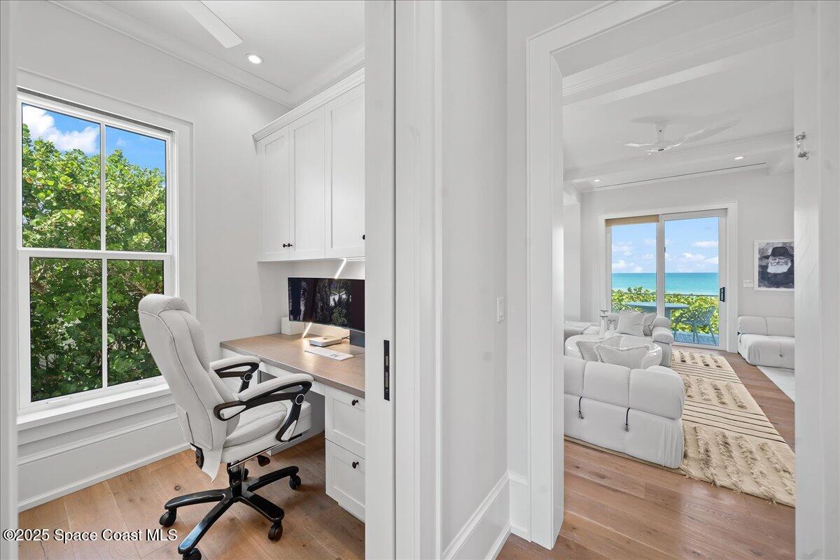5525 Jimmy Buffett Mem Highway Melbourne Beach, FL 32951 - Photo 21 of 56 a view of a workspace with furniture and a window