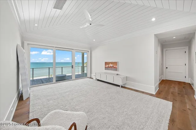 a spacious bedroom with a large bed and a walk in closet