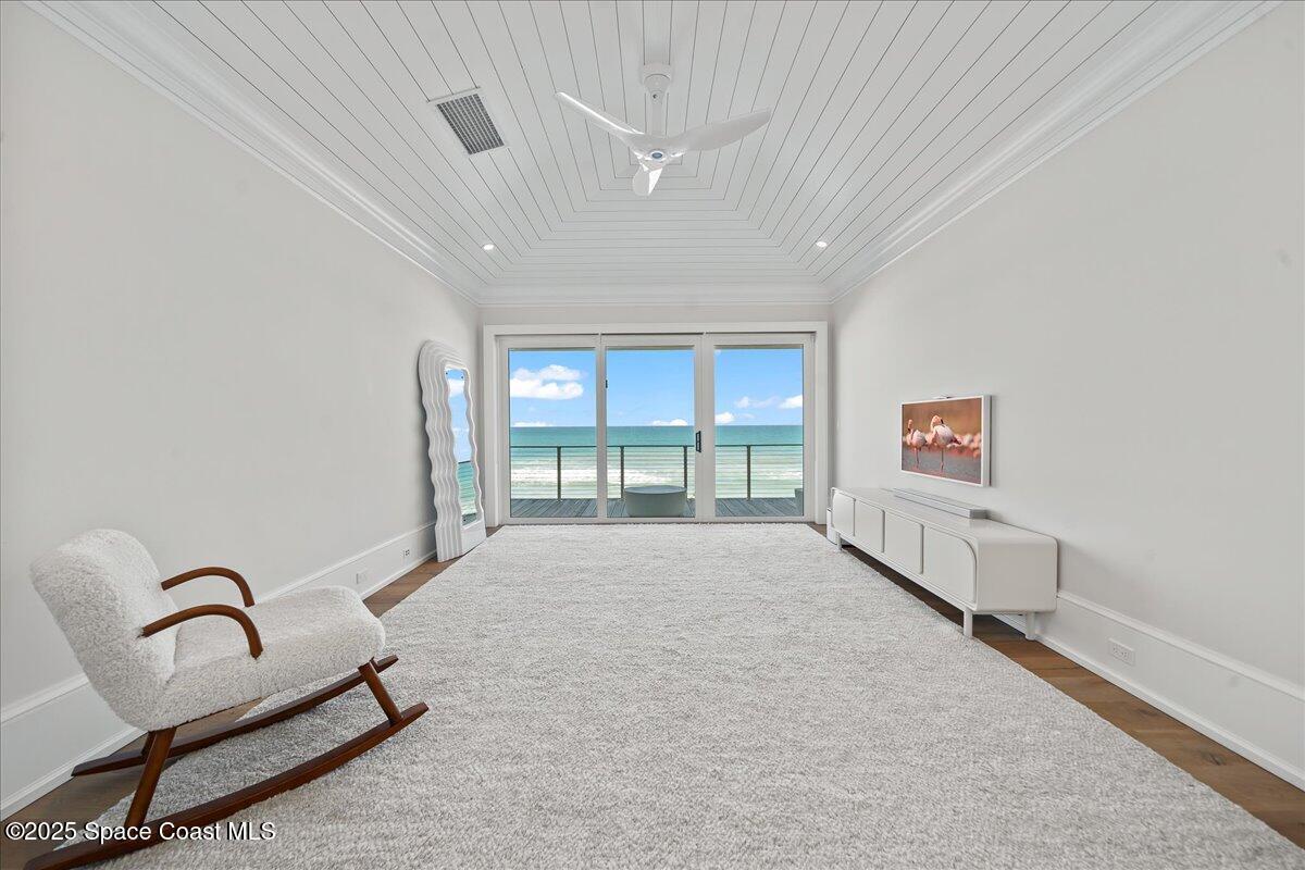 5525 Jimmy Buffett Mem Highway Melbourne Beach, FL 32951 - Photo 27 of 56 a spacious bedroom with a bed and a large window