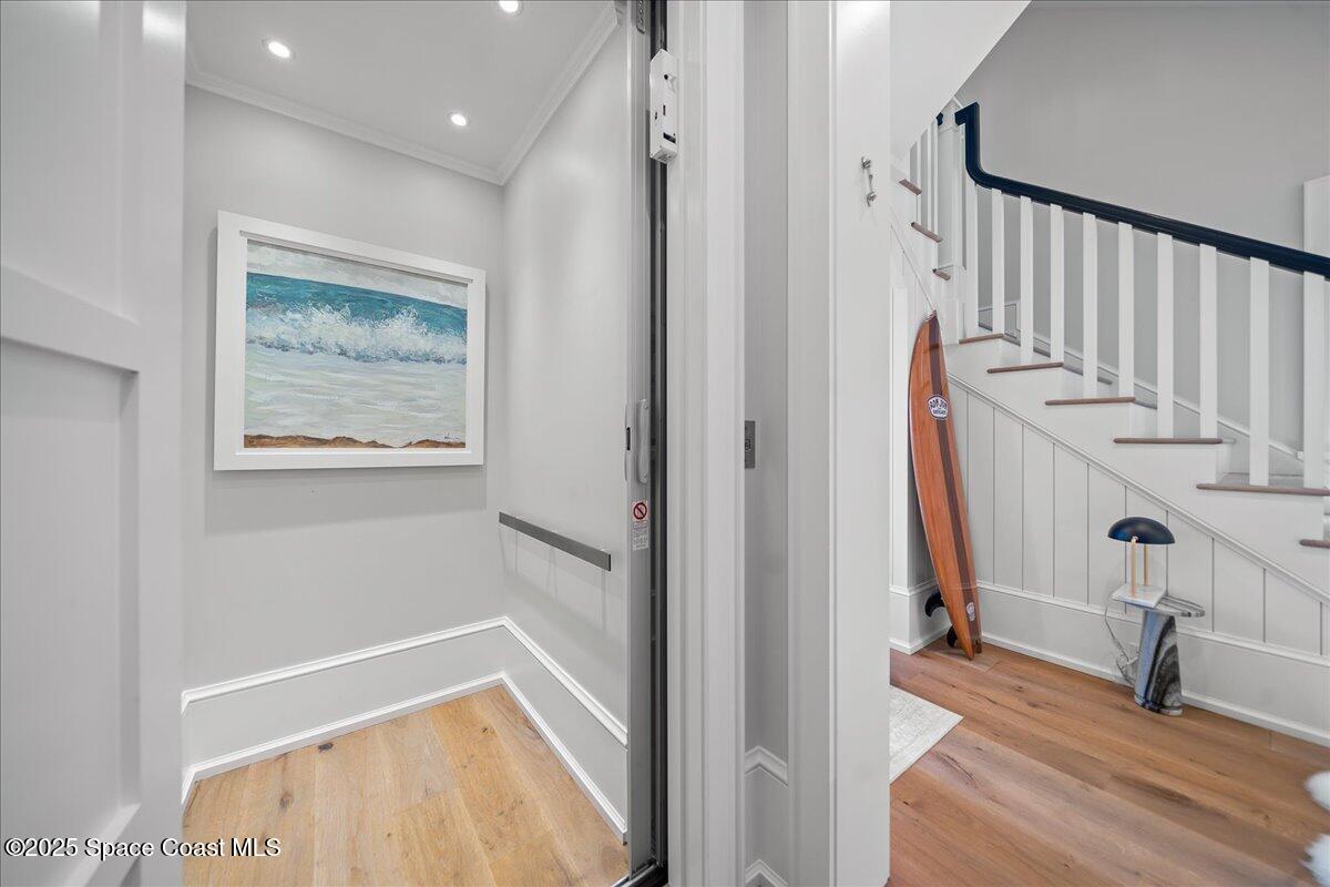 5525 Jimmy Buffett Mem Highway Melbourne Beach, FL 32951 - Photo 43 of 56 a view of an entryway with wooden floor and windows