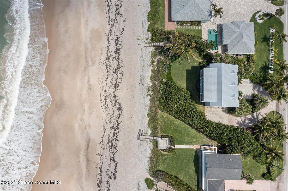 5525 Jimmy Buffett Mem Highway Melbourne Beach, FL 32951 - Photo 55 of 56 an aerial view of a house with a yard