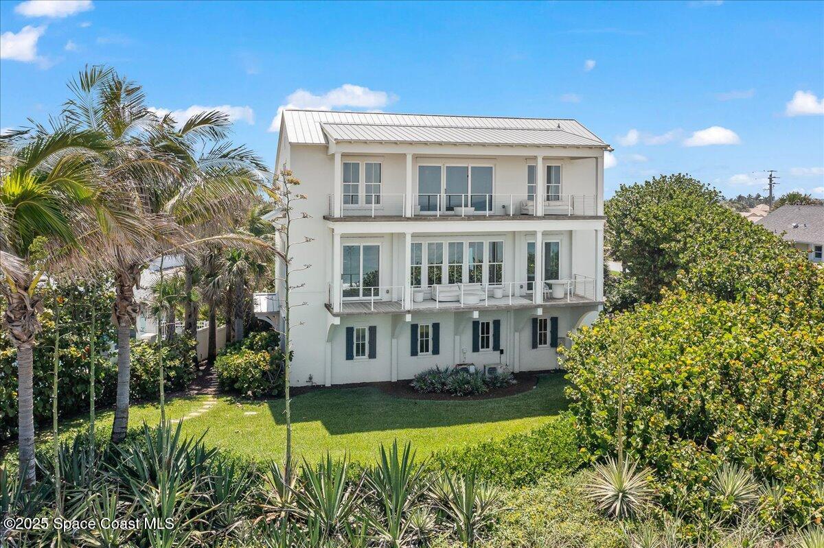 5525 Jimmy Buffett Mem Highway Melbourne Beach, FL 32951 - Photo 8 of 56 a view of a house with a swimming pool