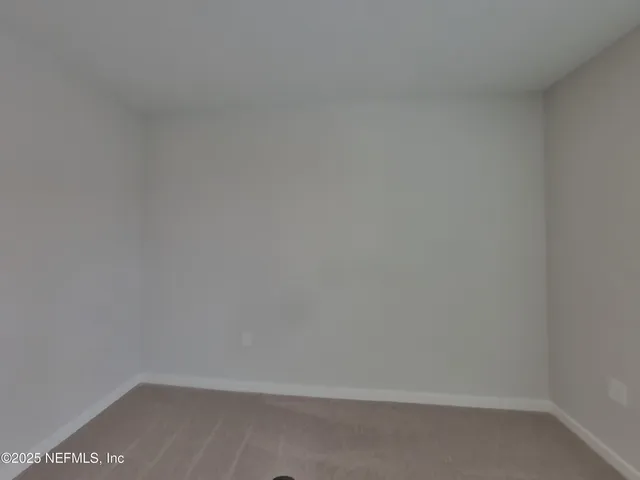 a bathroom with a bathtub and a toilet