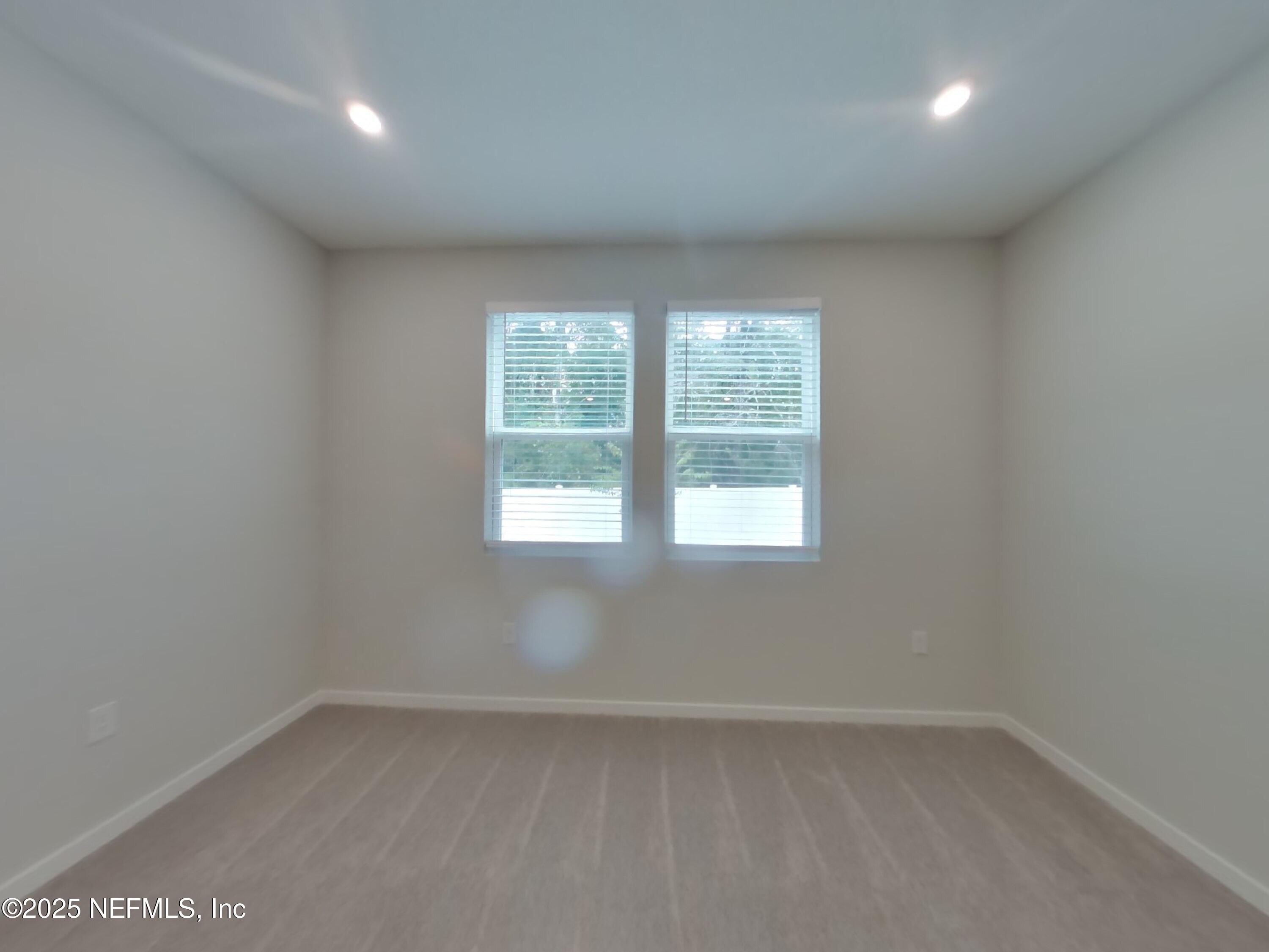 14897 Praline Court Jacksonville, FL 32218 - Photo 7 of 17 an empty room with a window