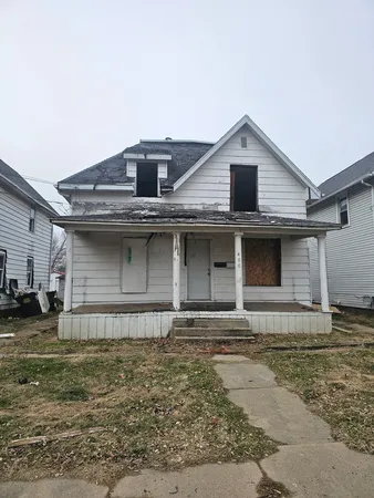 a front view of a house with garage