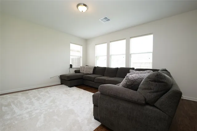a kitchen with granite countertop cabinets stainless steel appliances and wooden cabinets