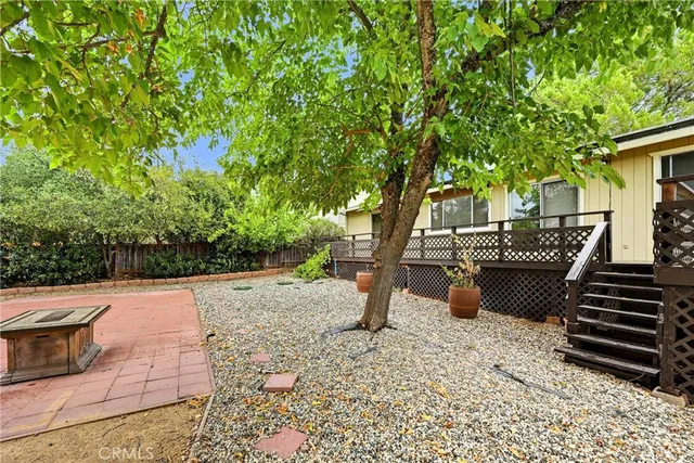 a view of a backyard with sitting area