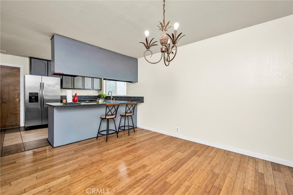 16927 Greenridge Road Hidden Valley Lake, CA 95467 - Photo 8 of 25 a view of a kitchen with a sink and chandelier