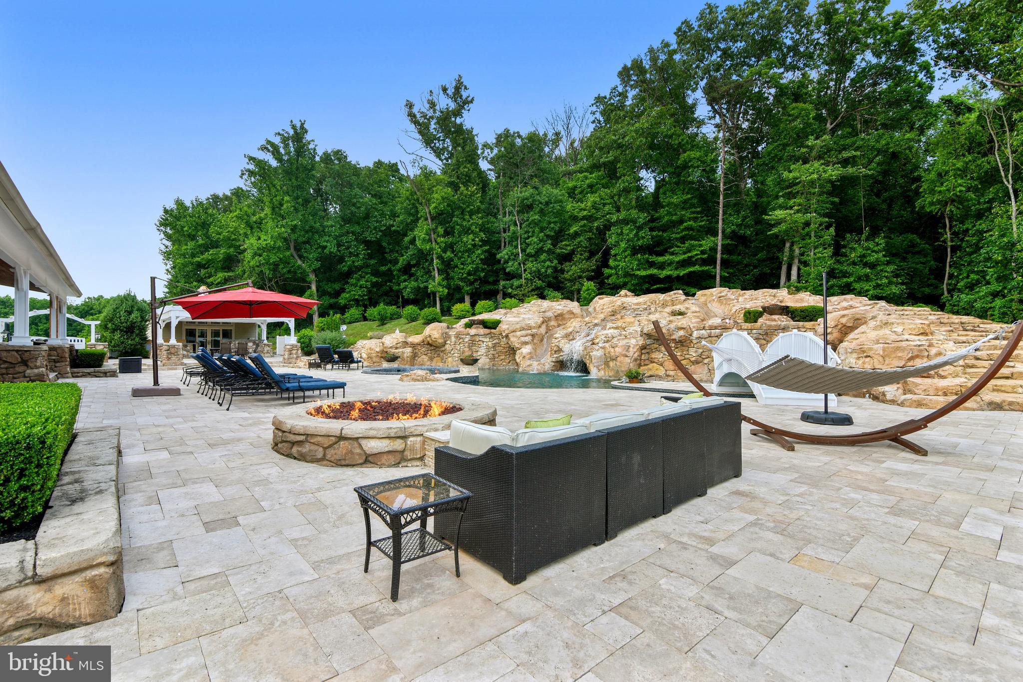 14416 Loyalty Road Leesburg, VA 20176 - Photo 51 of 61 Propane firepit, travertine patio