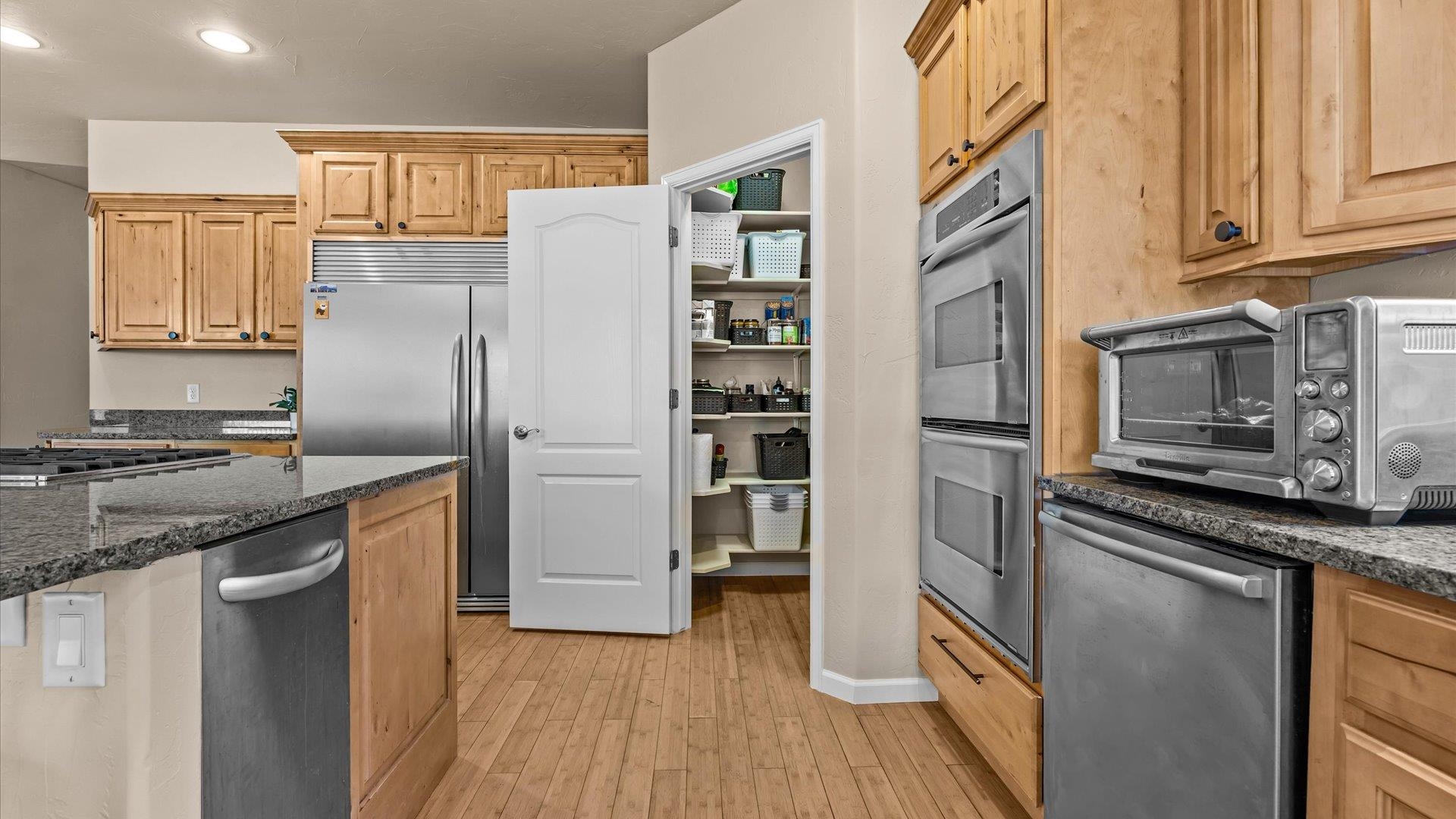 1712 Powis Lane Fruita, CO 81521 - Photo 12 of 39 a kitchen with stainless steel appliances granite countertop a refrigerator stove and sink