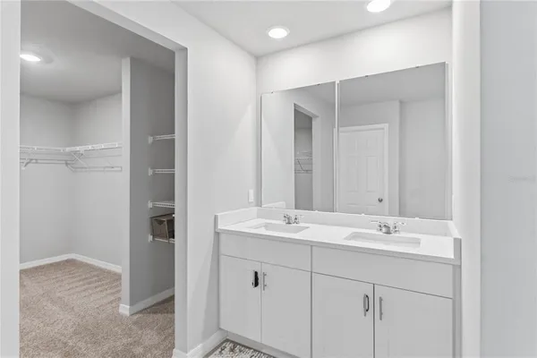 a bathroom with 2 sink and a mirror