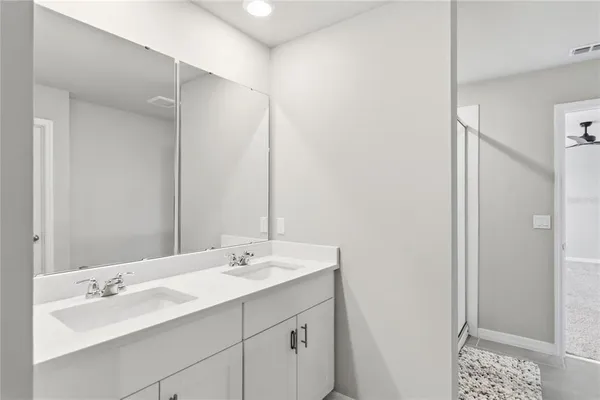 a bathroom with a glass shower door
