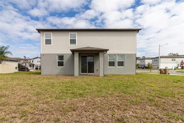 a house with yard in front of it