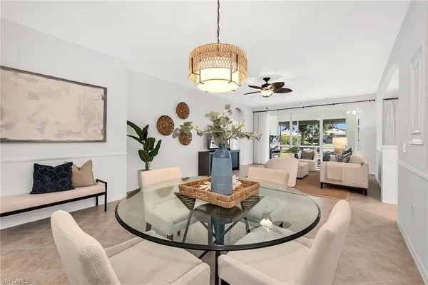 a dining room with furniture and wooden floor